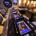Tabletop games line the bar at Flowing Tide Pub in northwest Las Vegas on Wednesday, Feb. 22, 2023. (Jeff Scheid/The Nevada Independent)