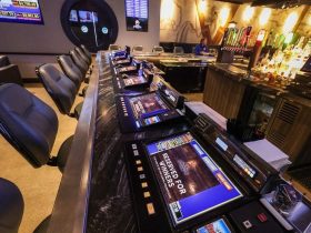 Tabletop games line the bar at Flowing Tide Pub in northwest Las Vegas on Wednesday, Feb. 22, 2023. (Jeff Scheid/The Nevada Independent)