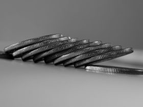 a stack of silver coins sitting on top of a table