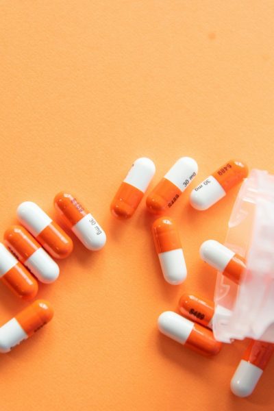 orange and white medication pill