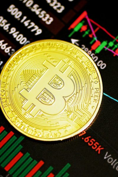 gold round coin on black surface