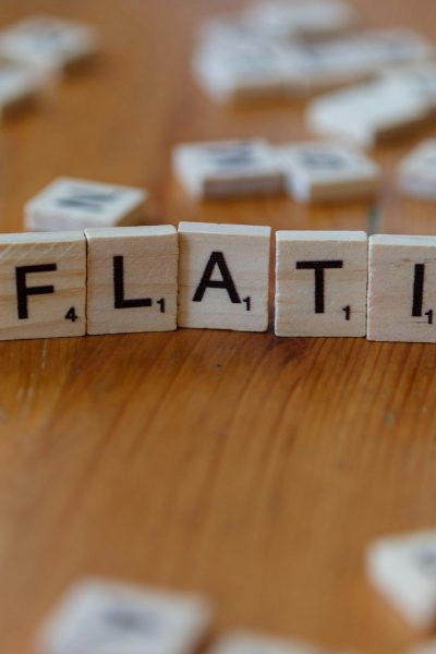 Inflation is spelled out using scrabble tiles.