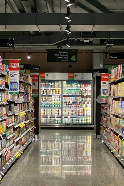grocery store aisle with stocked shelves
