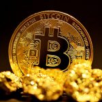 a bitcoin sitting on top of a pile of gold nuggets